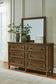 Sturlayne King Upholstered Panel Bed with Mirrored Dresser